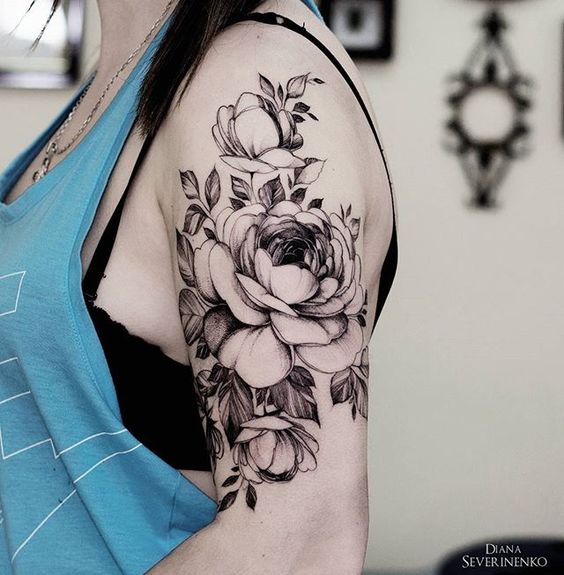 Picture Of black flower arm tattoo