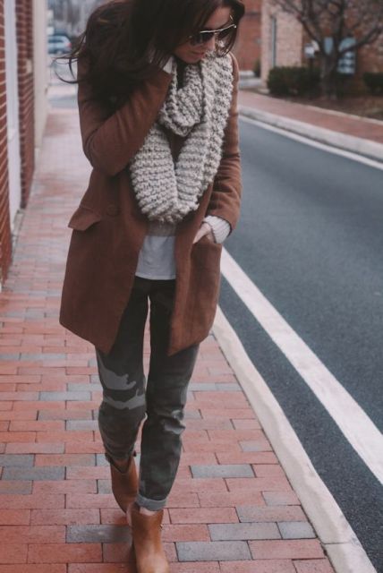 With printed trousers, brown ankle boots and brown coat