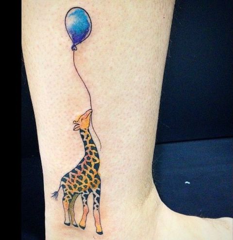Giraffe with blue balloon tattoo
