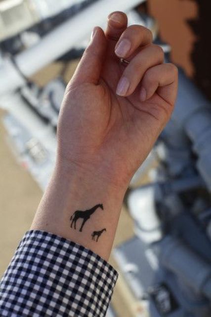 Two giraffes tattoo