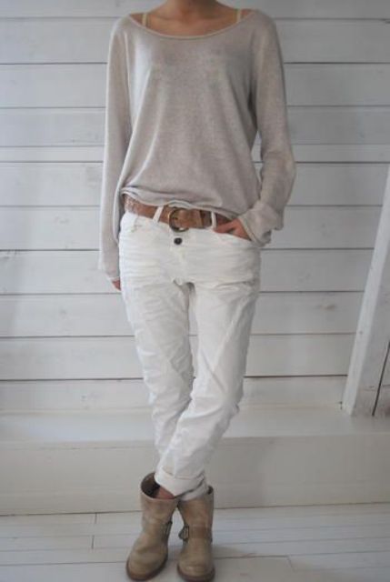 a neutral top, white jeans, a brown belt and matching brown ankle boots that look very relaxed