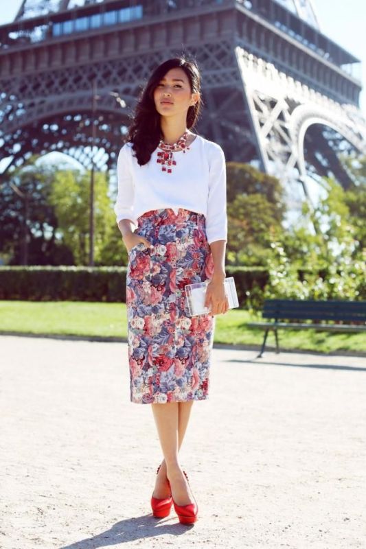 A white top, a bright floral pencil skirt, red shoes, a statement necklace and a white clutch for summer