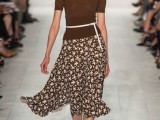 a brown top with short sleeves, a matching floral midi skirt, platform shoes for a spring work look