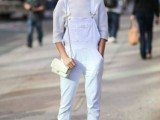 a total white look with a top, a denim dungaree, shoes and a crossbody to wear this spring