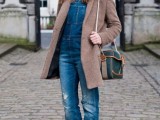 a white shirt, a blue denim dungaree, platform shoes and a brown coat for a cold spring day