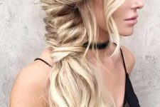 a boho Dutch fishtail braid with waves down and some waves framing the face is a gorgeous idea