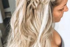 a boho wedding half updo with a double braid on top and waves down is a chic and beautiful solution for long hair