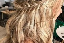 a classy boho half updo with a double braided halo and waves down plus a bump requires no accessories as it’s gorgeous itself