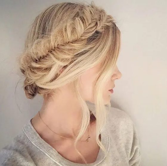 a fishtail braid halo updo with locks down is ideal for a boho bride and looks unique