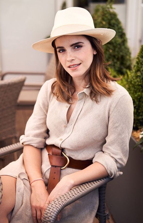 a grey linen shirtdress, a brown belt and a straw hat for a simple summer look