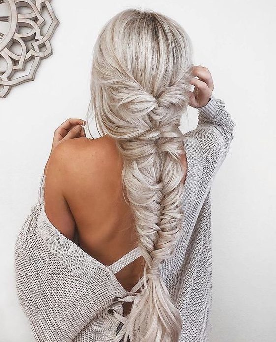 a jaw-dropping twisted and fishtail braid with bangs is a wow statement for any party