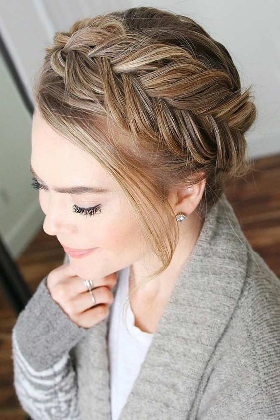 A loose fishtail braid updo with some face framing hair is a cool and catchy idea for medium and long hair