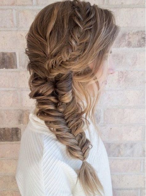 a volumetric fishtail braid paired with a halo and side bangs is a catchy and chic idea to wear to any party