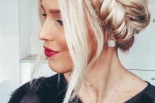 an updo with a pretty fishtail braid halo and face-framing locks is a cool and bold idea for the ohlidays if you have long hair