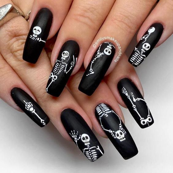 matte black and white skeleton nails for Halloween will always be cool and popular