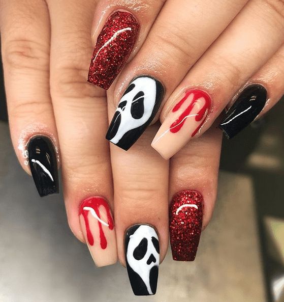 nude, red glitter, black and white nails with scary faces are a bold and cool solution for Halloween