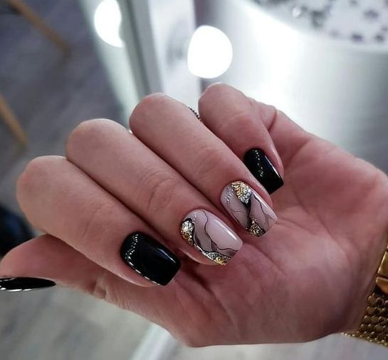 a black and nude nail with a geode effect and gold foil is a fantastic idea for NYE