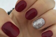 a classic red manicure spruced up with a silver glitter accent nail is perfect for Christmas