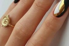 a fantastic black, gold and white manicure with curves is a lovely idea for NYE parties