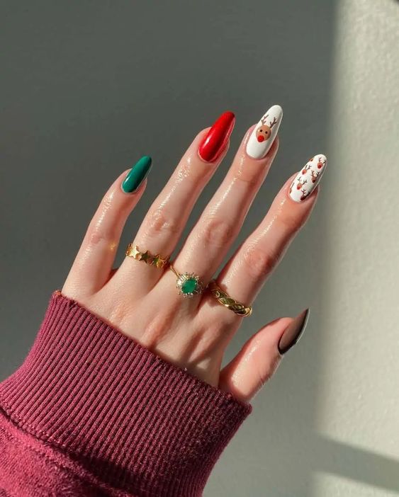a funny Christmas manicure with taupe, emerald and red nails, and a couple of deer print ones is fantastic