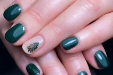 a green Christmas manicure featuring Christmas tree accent nails is a lovely and bold idea for the holidays
