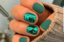 a matte emerald manicure with two accent sequin nails is a chic and bold idea for Christmas