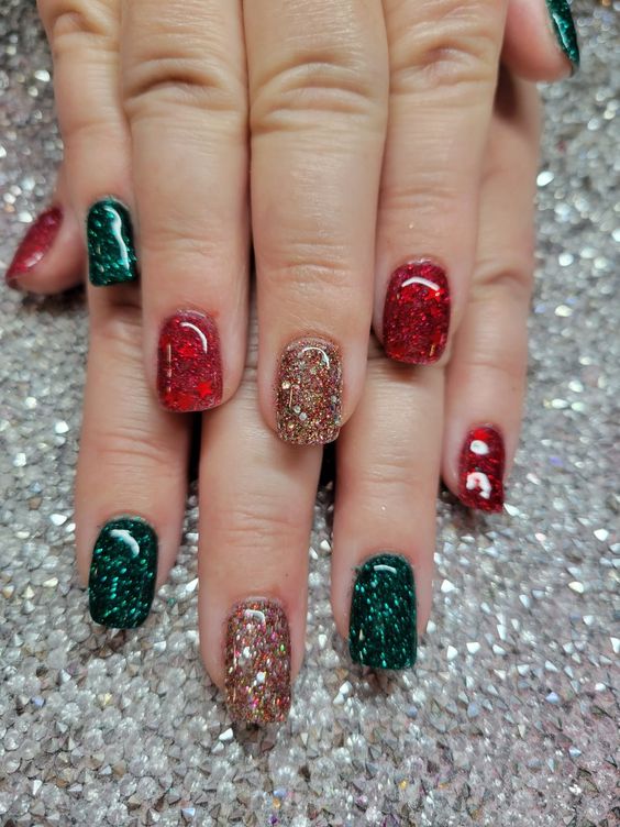 an emerald, red and gold glitter manicure is perfect for Christmas, it will add a touch of color