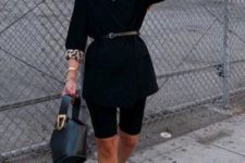 black bike shorts, a black thin belt ona black blazer, printed pumps and a black bucket bag is a trendy outfit with bike shorts that rock
