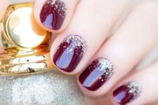 burgundy nails with gold glitter are always good for winter or winter holidays parties