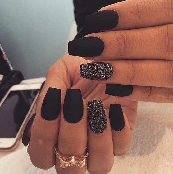matte black nails and black glitter accent ones are amazing for NYE parties, they will add a bling to your look