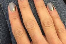 matte grey nails with geometric gold accents for a modern look at a NYE party