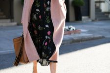 a black floral midi dress with a high neckline, black shoes, a pink coat and a brown tote for work