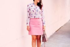 a summer work outfit with a bright floral shirt, a pink skirt, pink shoes and a mauve bag