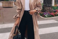 an oversized blush midi trench styled by the 90s is a hot trendy piece to wear this spring