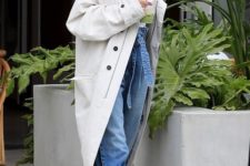 an oversized off-white double-breasted trench with black buttons by Hailey Baldwin