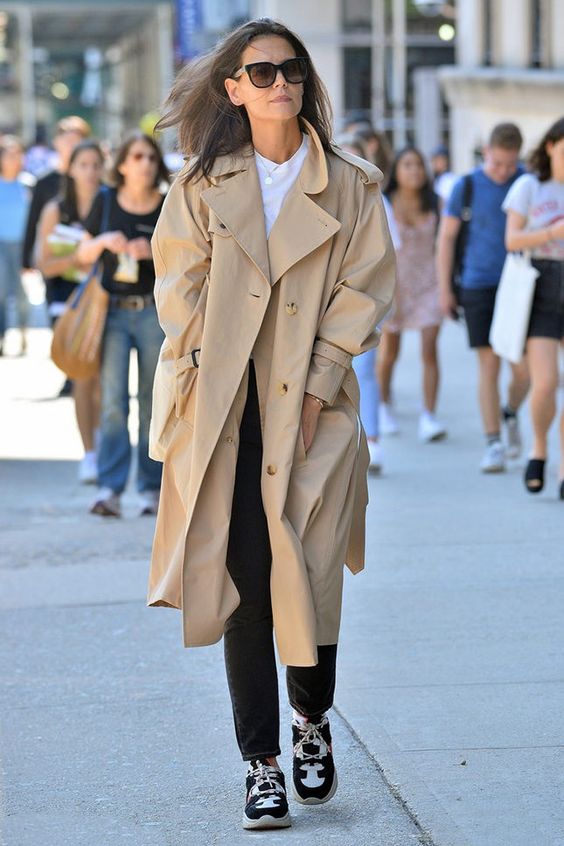 an oversized tan midi trench with pockets can be refreshed with trainers or sneakers for a trendy touch