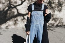 a black short sleeve shirt, a blue denim dungaree, a black cardigan and white sneakers to wear in spring