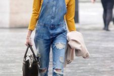a marigold top, a blue ripped denim dungaree, leopard shoes and a brown bag for a trendy spring outfit