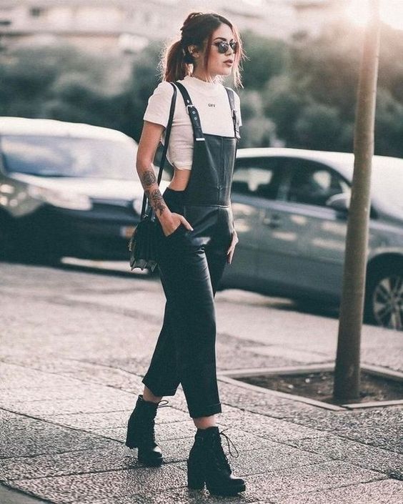 a white crop top, a black dungaree, black boots and a black bag for a grunge outfit