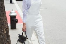 a white sheer top, a white dungaree, white shoes and a two tone bag for a bold summer outfit