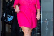 a hot pink wrap mini dress with long sleeves, white shoes and a black bag for a hot summer day