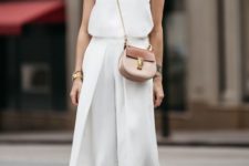 a white minimalist look with a sleeveless top, culottes, tan lace up shoes and a two tone bag