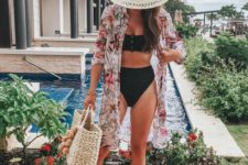 a black bikini and a colorful floral coverup and blush mules for a trendy beachy outfit