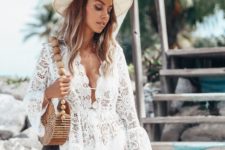 a delicate white lace mini beach dress with long bell sleeves is ideal for a boho beach look