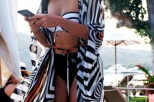 a monochromatic bikini and a matching striped beahc coverup for a contrasting and super bold look