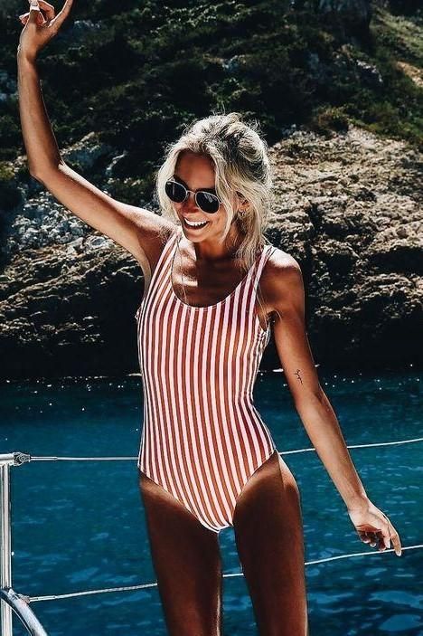a vertical red stripe one piece swimsuit with a scoop neckline is classics that never goes out of style