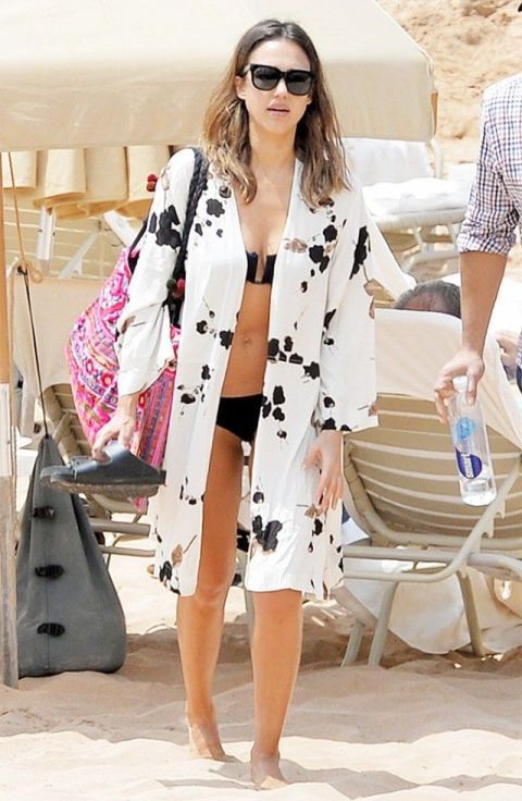 a white coverup with a black chaotic pattern is a nice pair for a black bikini or a white one