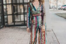 a colorful stripe sequin jumpsuit paired with black strappy shoes is a lovely idea for NYE, bold, catchy and fun
