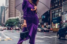 a purple velvet draped midi dress with slight puff sleeves, a high neckline, sheer socks and black shoes