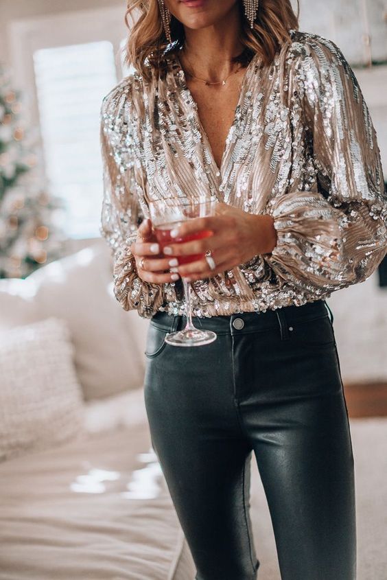 black leather pants, a silver sequin shirt are a nice combo for celebrating NYE, it's a timeless idea with plenty of shine